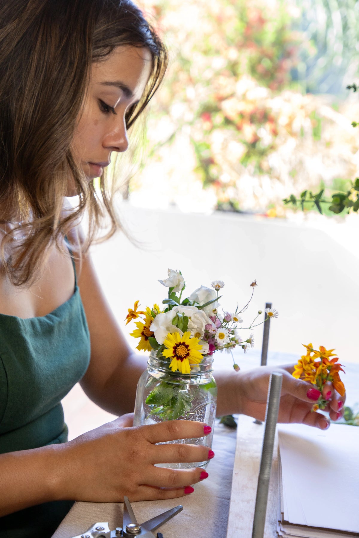 business owner placing flowers into press